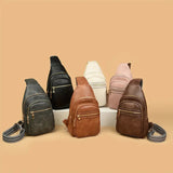 Collection of leather sling bags in various colors on a beige background